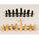 A TRAVELLING CHESS SET in a mahogany case.