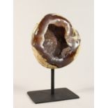 A GEODE on a metal stand