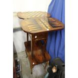 A Victorian folding games table top (lacking base) together with other small furniture.