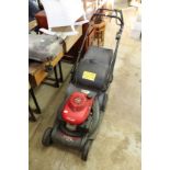 A Honda HRX 476 petrol rotary lawnmower.