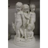 A 19th century white porcelain candelabra base modelled as children and a goat by a tree stump.