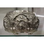 A good large Thai silver bowl with embossed decoration, 9ins diameter, 23ozs.