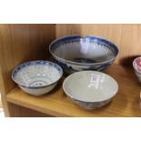 Three Chinese blue and white bowls.