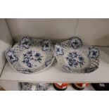 A pair of Meissen blue and white porcelain baskets with pierced sides.