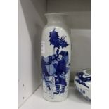 A Chinese blue and white decorated sleeve vase.