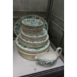 A quantity of Wedgwood plates etc. with pale green leaf decoration.