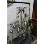 A good large wrought iron and cut glass Venetian style chandelier.