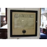 A large framed and glazed indenture.