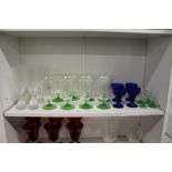 Colourful glassware to include a set of eight etched glass drinking glasses and four Bristol Blue