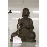 A bronze seated Buddha.