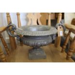 A small cast iron urn.
