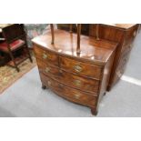 A small 19th century mahogany bow front chest of two short and two long drawers on splay bracket