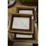 A set of three classical style moulded porcelain plaques in gilt and velvet frames.