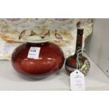 A small Chinese flambe glazed bowl and a small bottle vase.