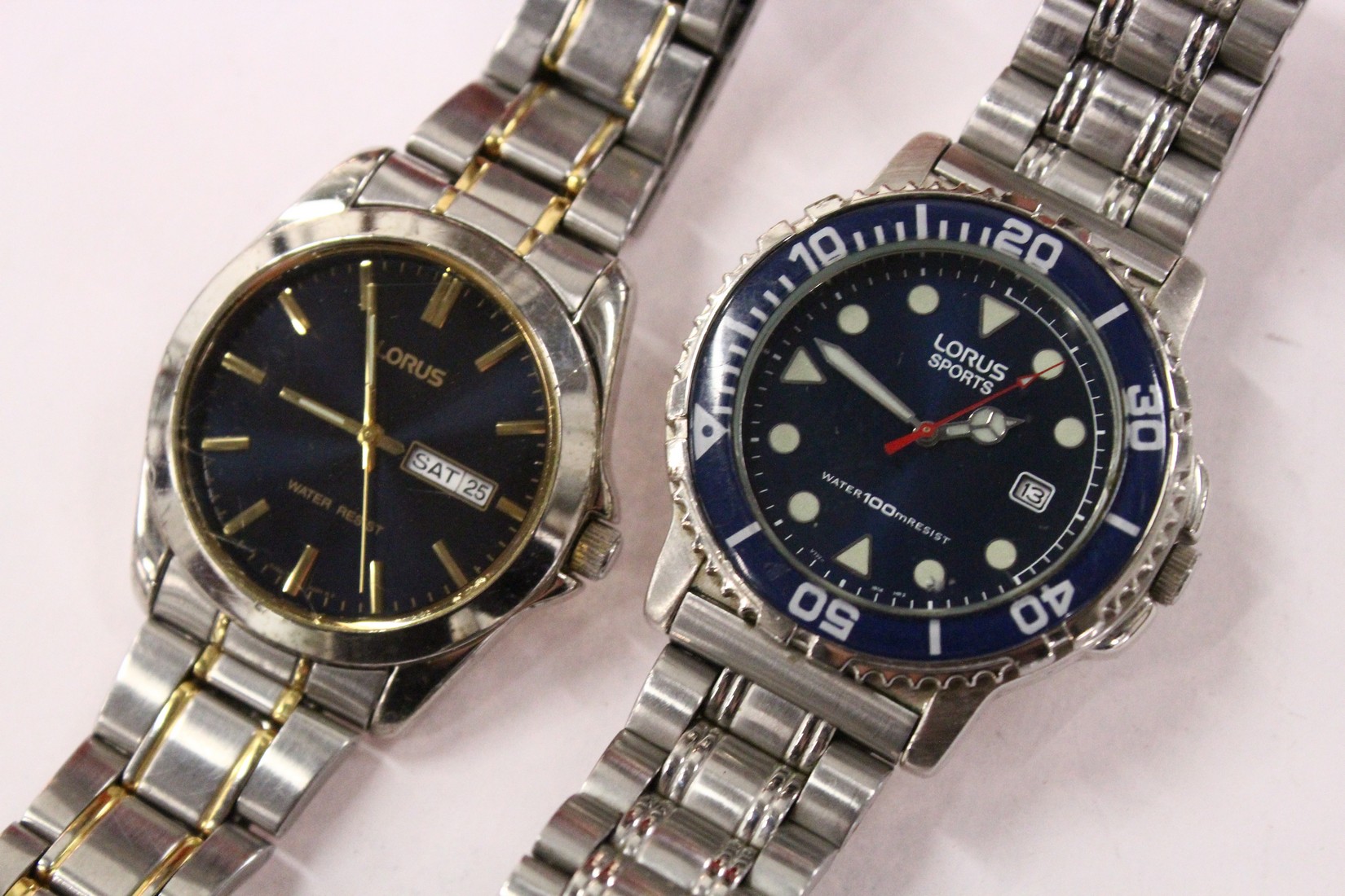 Two stylish gent's stainless steel wristwatches.