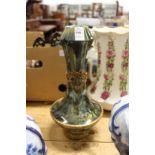 An unusual green glazed and ormolu mounted garlic neck vase.