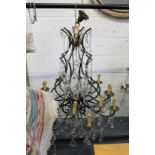 A good large wrought iron and cut glass chandelier.