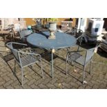 A circular metal garden table and four matching armchairs.