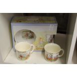 A Peter Rabbit boxed breakfast set and two other cups.