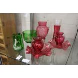 A Mary Gregory style green glass jug and bowl and various cranberry glassware.