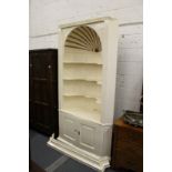 A 19th century cream painted barrel back corner niche with cupboards below.