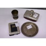 A silver blotter, a small photograph frame, egg cup and dish.