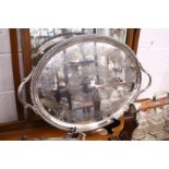 A good large twin handled oval plated tray with engraved decoration.