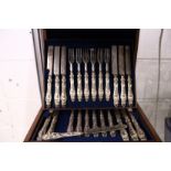 A good set of eighteen dessert knives and forks in a fitted case.