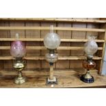 Three decorative oil lamps.