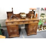 An early 20th century Indian rosewood sideboard with galleried back, three frieze drawers and