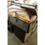 A metal trunk containing eiderdowns together with a two drawer metal filing cabinet.