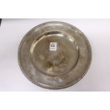 A circular silver plate with gadrooned edge, 9ins diameter, Sheffield 1928, 15ozs.