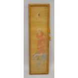 A JAPANESE PAINTED TEXTILE PICTURE OF A ARHAT HOLDING HIS BOWL - stood upon the shi shi dog, the