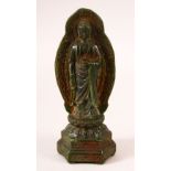A CHINESE CARVED JADE FIGURE OF BUDDHA, stood upon lotus formed base with halo, 20cm high.
