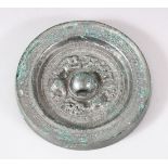 A CHINESE SILVERED BRONZE MIRROR, the centre with dragon motifs and script, 12.5cm diameter.