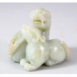 A GOOD CHINESE CARVED JADE FIGURE OF TWO FOO DOGS, 6.5cm high, the base 5.5cm x 6.5cm.