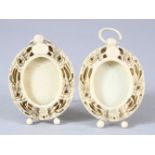 A PAIR OF 19TH CENTURY CHINESE CANTON CARVED IVORY MINIATURE FRAMES - the small frames bnoth with