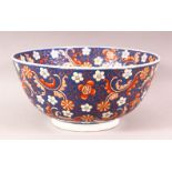 A CHINESE BLUE GROUND PORCELAIN BOWL, incised and painted with flower head design, mark to base,
