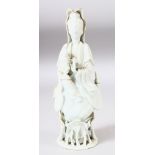 A CHINESE BLANC DE CHINE PORCELAIN FIGURE of guanyin upon lotus and lily pads, 22cm high.