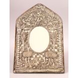 A FINE 19TH CENTURY OTTOMAN EMBOSSED SILVER MIRROR FRAME- Embossed with two ostrich amongst flora,