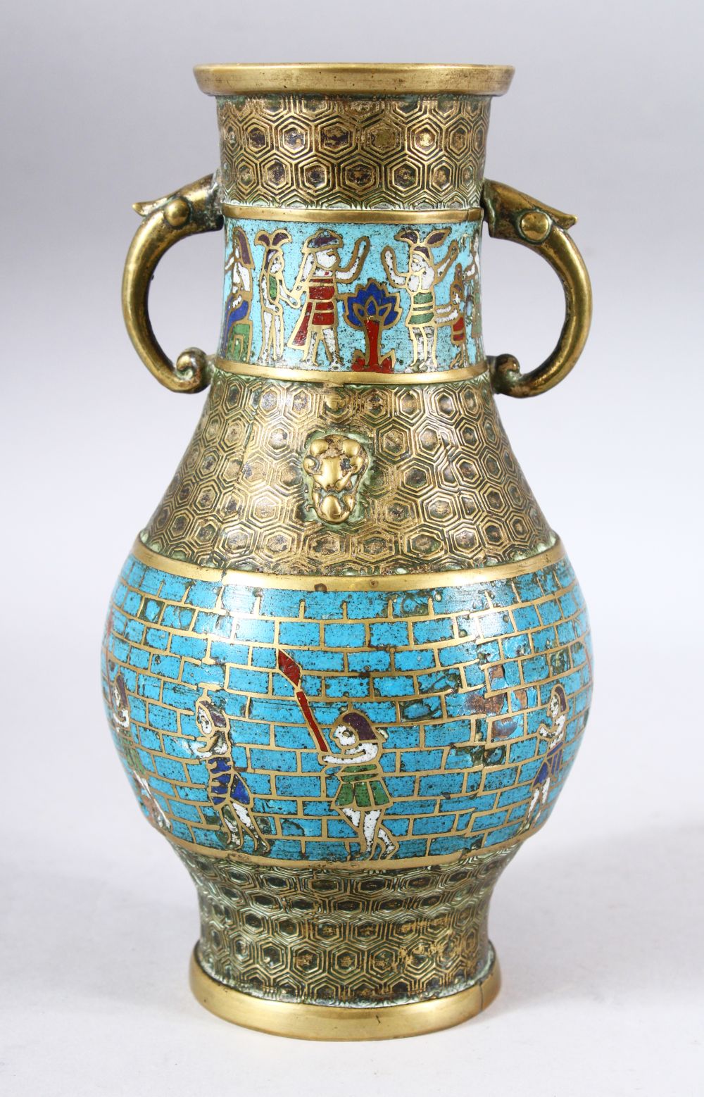 A CHINESE EXPORT CLOISONNE TWIN HANDLE VASE, the body with brick joint style blue ground with