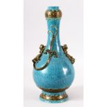 A CHINESE SPECKLED TURQUOISE GROUND BOTTLE VASE, with moulded chilong to the body and gilded
