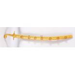 AN ORNAMENTAL ISLAMIC SWORD / SAIF AND GILT SCABBARD, the blade with embossed calligraphy, the