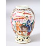 A SMALL CHINESE FAMILLE ROSE CADDY, painted with two panels of figures in different settings, 10.5cm