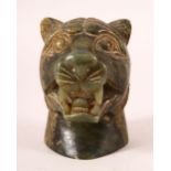 AN INDIAN CARVED JADE TIGER HEAD BUST, the tiger bearing its teeth, 11cm high.