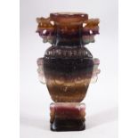 A CHINESE CARVED AMETHYST STONE VASE - Carved in the form of a vase and decorated with flora, 20cm