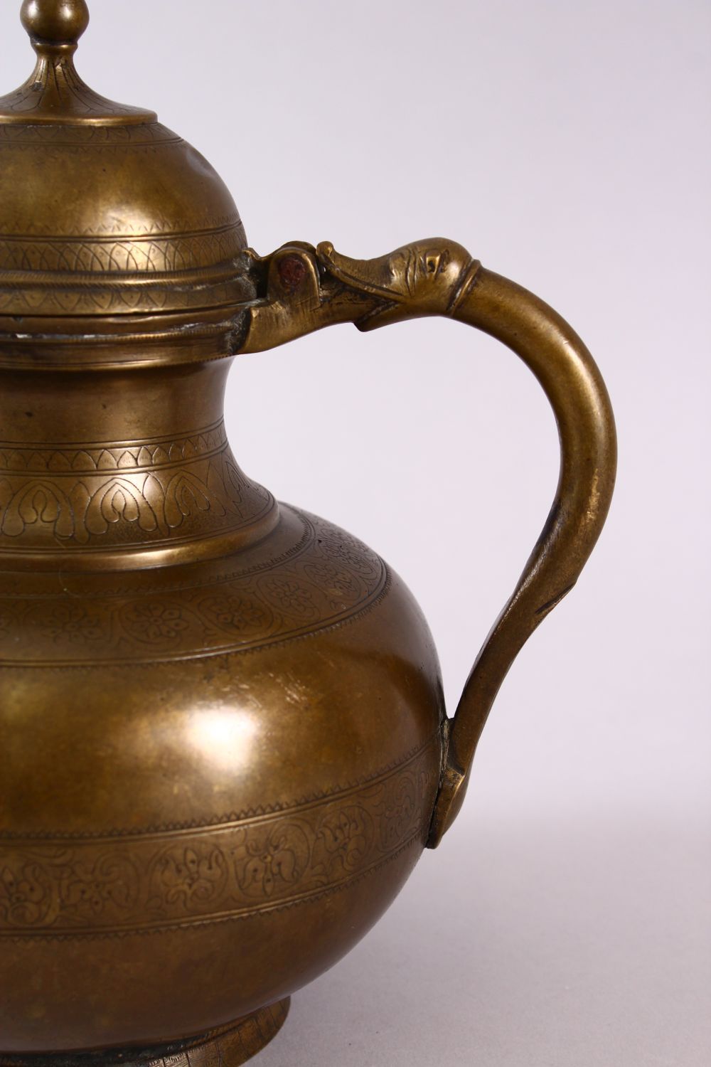 AN 18TH CENTURY MUGHAL INDIAN BRASS EWER, with animal formed handle and spout, 22cm high. - Image 2 of 6