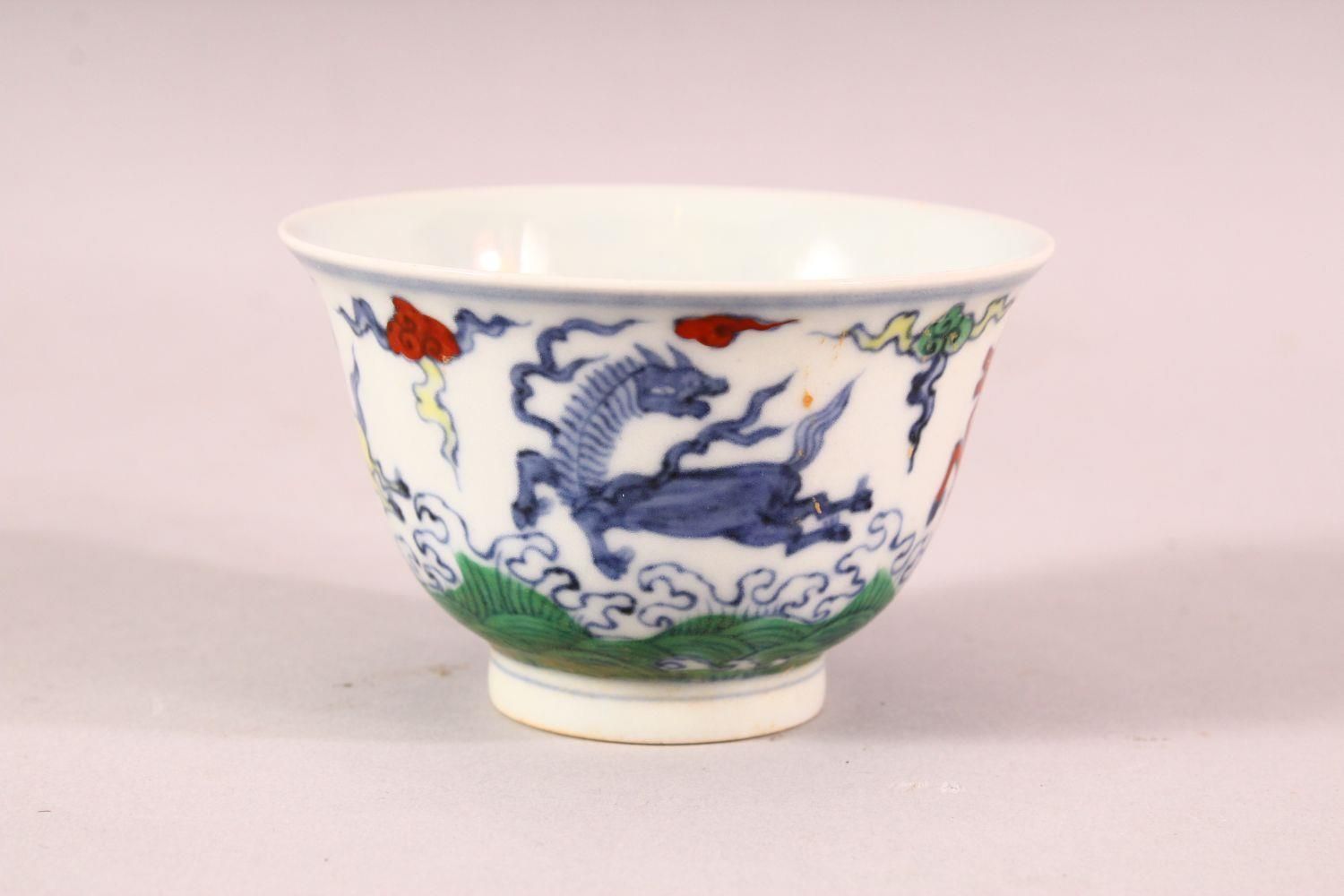 A CHINESE DOUCAI PORCELAIN HORSE CUP - depicting four horses amongst clouds, the base with a 6 - Image 3 of 7