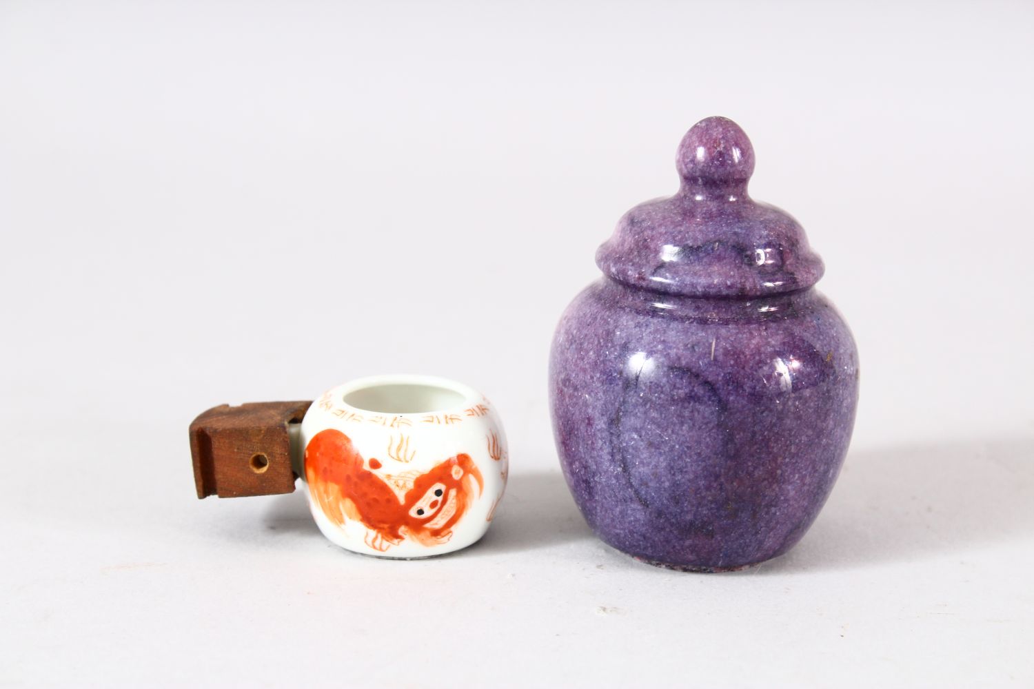 A CHINESE CARVED AMETHYST CALLIGRAPHIC OBJECT & IRON RED PORCELAIN CUP - A miniature iron red - Image 2 of 3