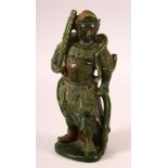 A CHINESE CARVED JADE FIGURE OF A WARRIOR, 22cm high.